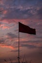 Flying Flag image in Moody sky background . Cloudy sky . Sunset sky .