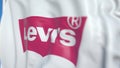 Flying flag with Levi Strauss Co logo, close-up. Editorial 3D rendering
