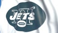Flying flag with New York Jets team logo, close-up. Editorial 3D rendering