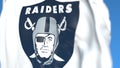 Flying flag with Oakland Raiders team logo, close-up. Editorial 3D rendering