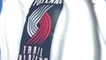 Flying flag with Portland Trail Blazers team logo, close-up. Editorial 3D rendering