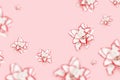 Flying flowers of peony lily, white blooming lilies flower with red border on pink background