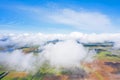 Flying through the fluffy clouds layers. Camera above ground. Amazing soft white clouds moving slowly on the clear sky Royalty Free Stock Photo