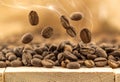 Flying fresh coffee beans as a background with copy space. Coffee beans falling down with white steam vapour. Royalty Free Stock Photo