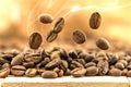 Flying fresh coffee beans as a background with copy space. Coffee beans falling down with white steam vapour. Royalty Free Stock Photo