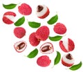 Flying fresh lychee with slices and green leaves isolated on white background. clipping path Royalty Free Stock Photo