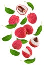 Flying fresh lychee with slices and green leaves isolated on white background. clipping path Royalty Free Stock Photo