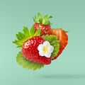 Flying Fresh tasty ripe strawberry with green leaves Royalty Free Stock Photo