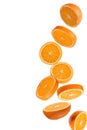 Flying fruits. Falling sliced orange fruit isolated on white background
