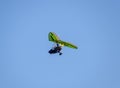 Flying hang-glider with a motor in the sky. Trike, flying in the sky with two people. Extreme Entertainment travelers