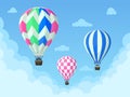 Flying hot air balloons, colorful aerostat soars in blue sky. Vintage hot air balloon, stripped sky transport vector