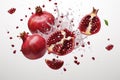 Flying juicy chopped pomegranate on white background. Food levitation