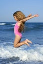 Flying jump beach girl in blue sea shore