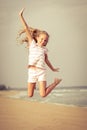 Flying jump beach girl on blue sea shore Royalty Free Stock Photo