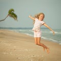 Flying jump beach girl on blue sea shore Royalty Free Stock Photo