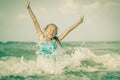 Flying jumping beach girl at blue sea shore