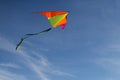 Flying a kite. Bright kite against the blue sky. Sunny day Royalty Free Stock Photo