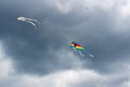 Flying kite on the cloudy blue sky background Royalty Free Stock Photo