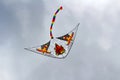 Flying kite on the cloudy blue sky background Royalty Free Stock Photo