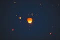 Flying lantern in the dark sky at night Royalty Free Stock Photo