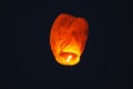 Flying lantern in the dark sky at night Royalty Free Stock Photo