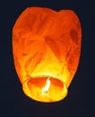 Flying lantern in the dark sky at night Royalty Free Stock Photo