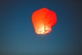 Flying lantern in the dark sky at night Royalty Free Stock Photo