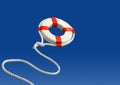 Flying life preserver for help Royalty Free Stock Photo