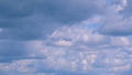 Flying moving white clouds in a blue sky. Blue sky background with many layers tiny stratus cirrus clouds.Time lapse. Royalty Free Stock Photo