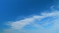 Flying moving white clouds in a blue sky. Blue sky background with many layers tiny stratus cirrus clouds. Time lapse. Royalty Free Stock Photo