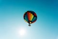 Flying in a multi-colored hot air balloon. Bottom up view. Copy space Royalty Free Stock Photo