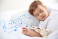 Flying music notes and cute baby sleeping with toy at home. Lullaby songs