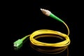Flying optical fiber cable isolated on the black background