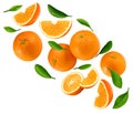 Flying orange fruits with slices and green leaves isolated on white background. clipping path Royalty Free Stock Photo