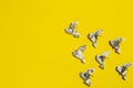 Flying origami dove on yellow background. Origami bird from music paper. Royalty Free Stock Photo