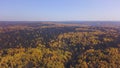 Flying over the autumn mixed forest. Clip. Breathtaking colorful trees Ural, Russia, Aerial View the autumn natural