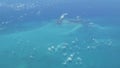 Flying over The Bahamas. Beautiful ocean colors. Actual aerial footage