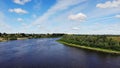 Flying over beautiful country side green landscape with river, belarus nature, summer sunny, aerial shot, drone, view