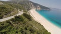 Flying over a breathtaking beach and cliffs with serpentine