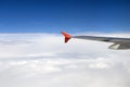 Flying over clouds in a plane. Royalty Free Stock Photo