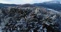 Flying over the Cornish-Windsor Covered Bridge and Connecticut River in New England after a snowstorm