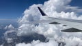 Flying over Miami. View of east coast from plane's window. Beautiful white clouds against blue sky. The turquoise waters Royalty Free Stock Photo