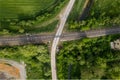aerial drone shot of a railroad in between rural fields and vegetation Royalty Free Stock Photo