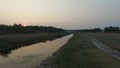 Flying over the river at sunset.