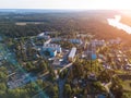 Flying over urban-type settlement Nikolskiy, Svir river and summer green forests of Leningrad region