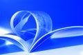 Flying pages on blue Royalty Free Stock Photo