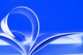 Flying pages on blue Royalty Free Stock Photo