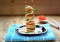 Flying pancakes, red caviar and basil leaves. Levitating food Royalty Free Stock Photo