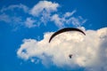 Flying paraglider on a blue sky with clouds Royalty Free Stock Photo