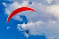 Flying paraglider on a blue sky with clouds Royalty Free Stock Photo